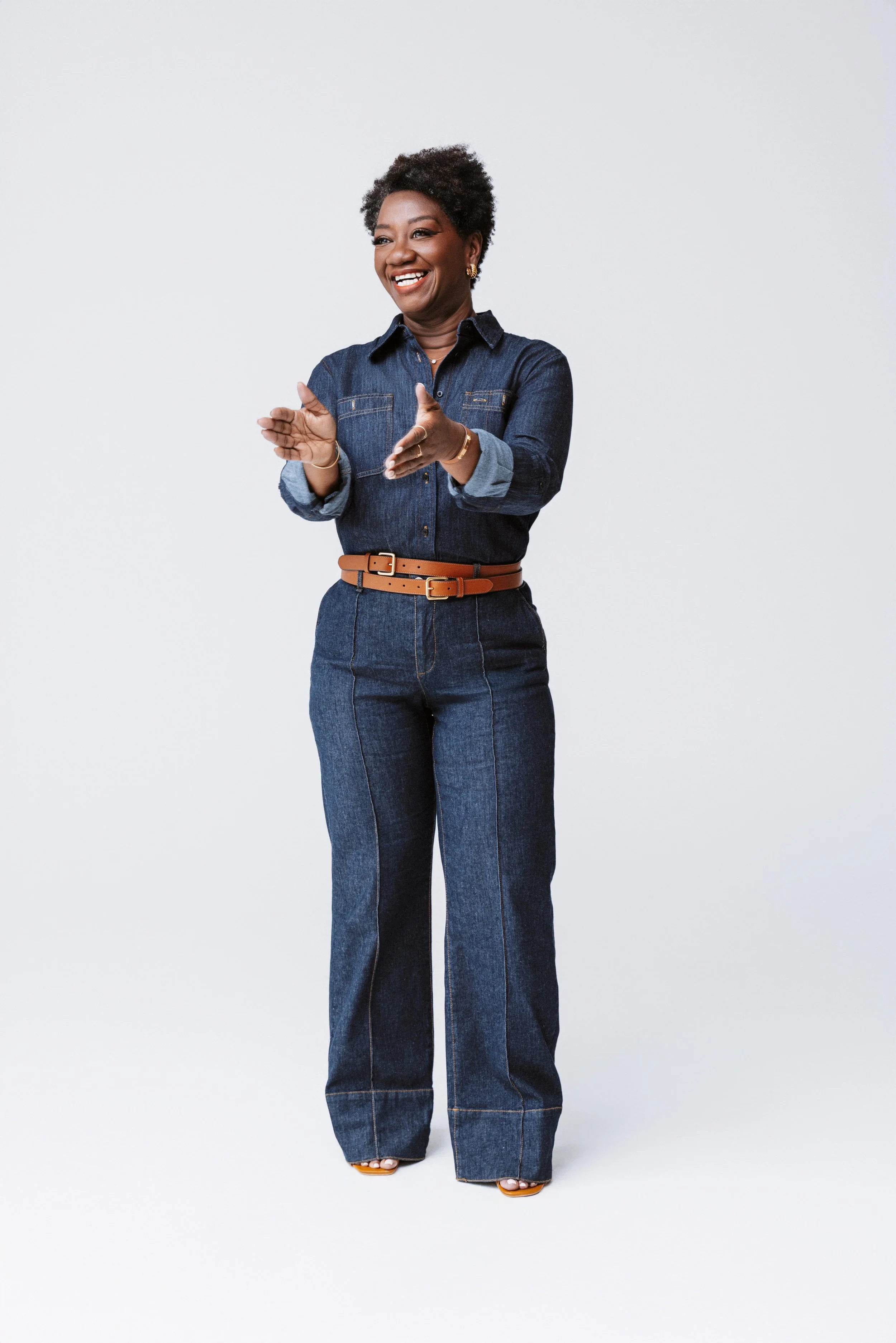 Captured mid-motion, this branding image showcases Tressie McMillan Cottom’s joy and authenticity. Styled in classic denim against a clean backdrop, it’s a fresh take on modern professional photography from a Nashville Commercial Photographer.
