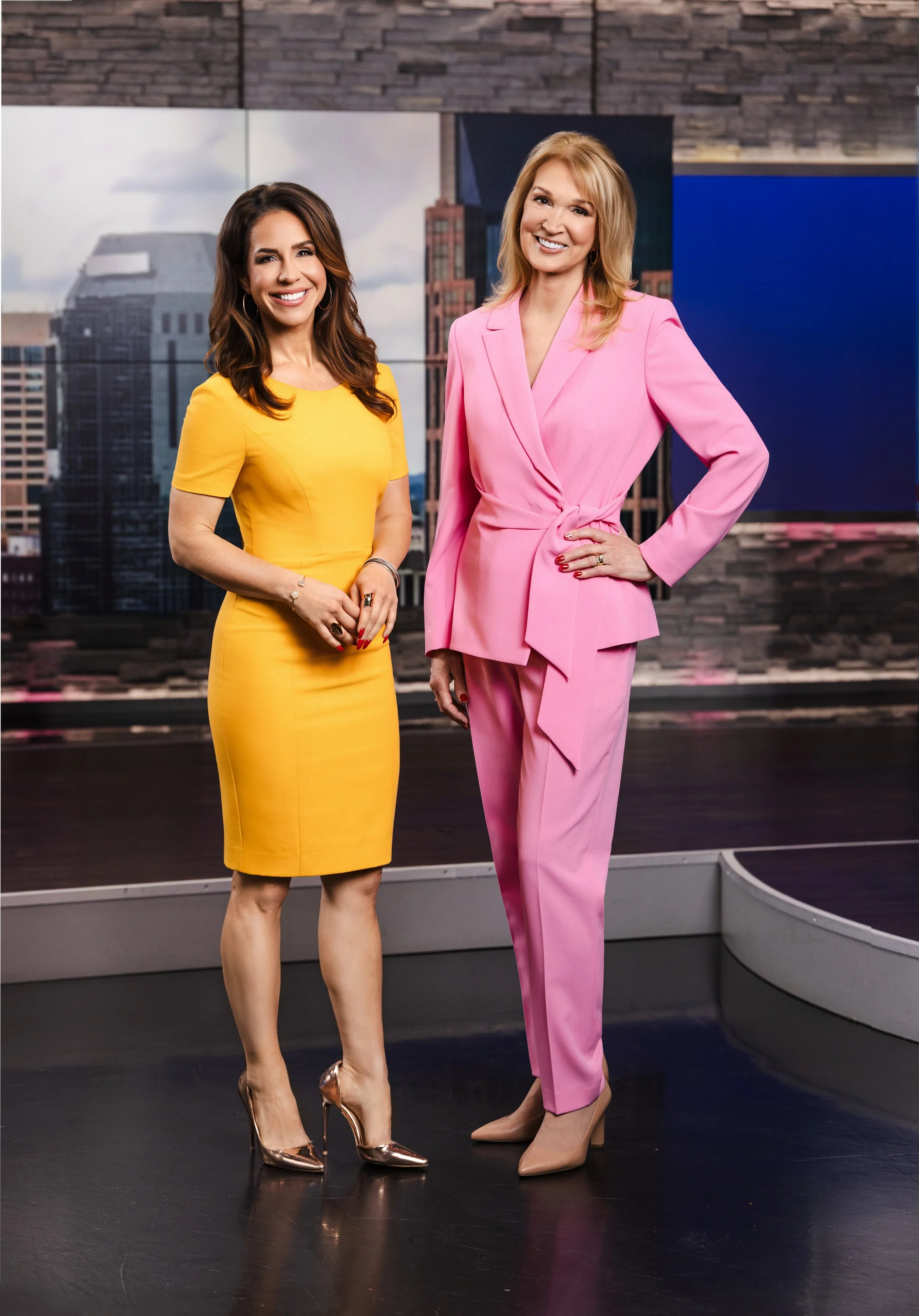 Portrait of two female WSMV news anchors standing together inside the Nashville television studio, photographed by Tausha Dickinson.