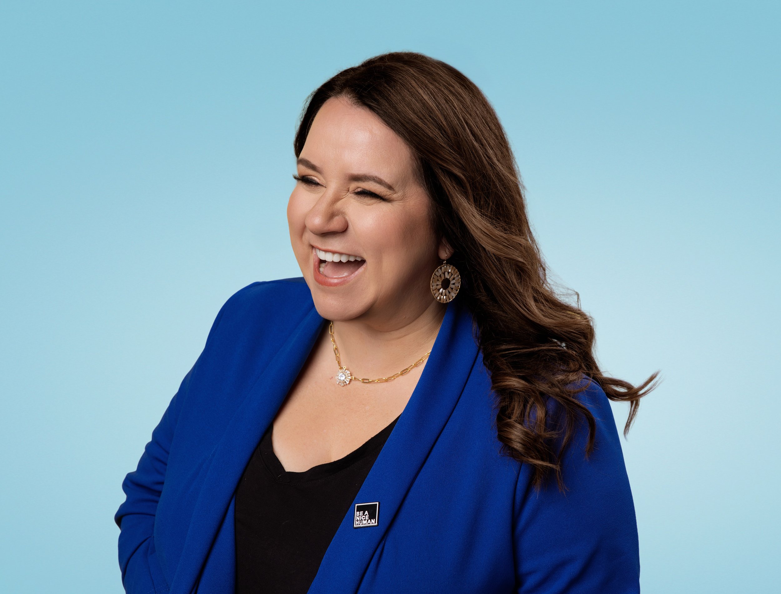 Nashville photographer Tausha Dickinson smiling in a blue blazer beside a call to action for free strategy calls for photographers building profitable businesses.