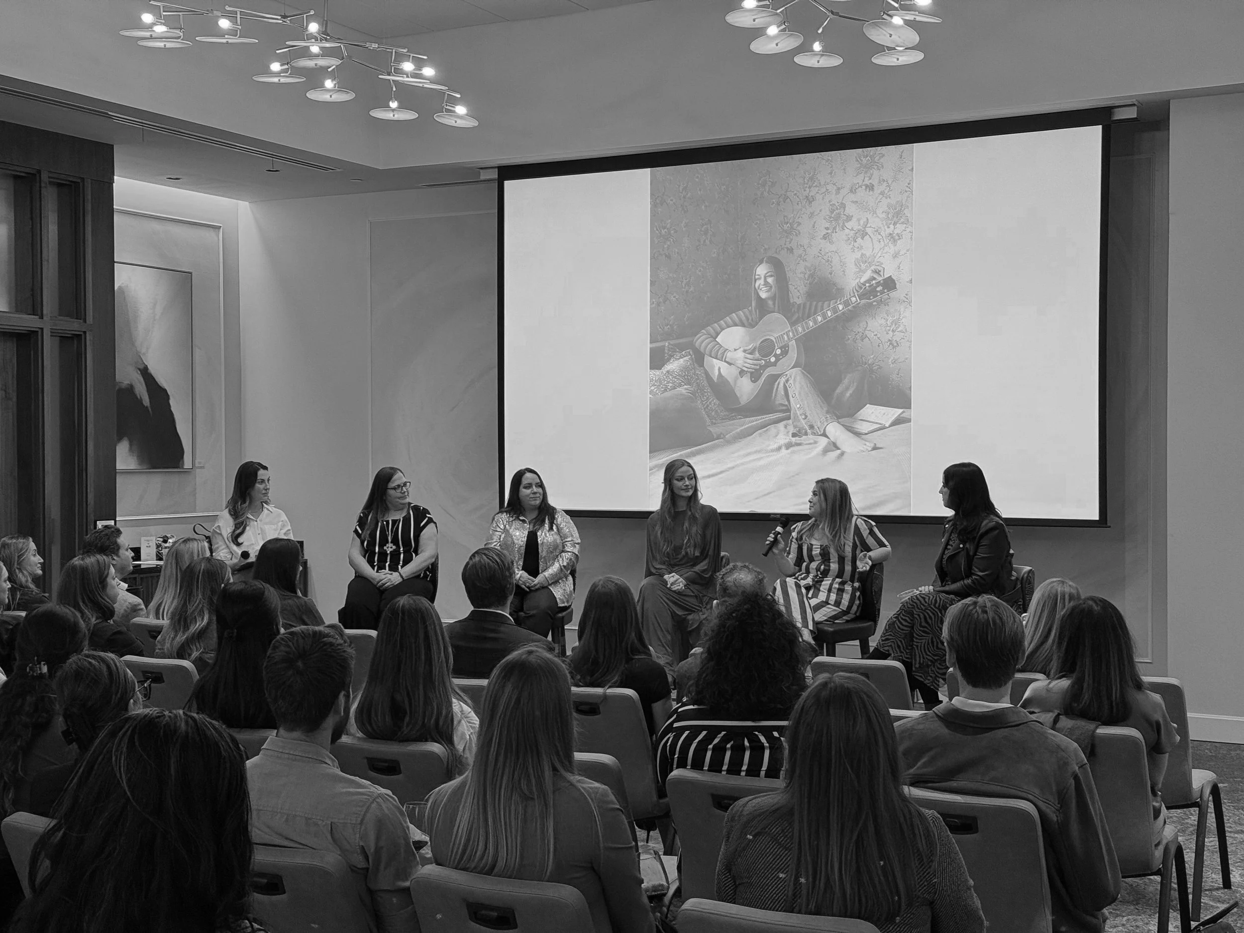 This photo captures an engaging panel talk at Nashville Design Week, held at Tempo Hotel. With photographer Tausha Dickinson among the speakers, the conversation centers around the creative process and inspiration behind the Mary Louise photoshoot. T