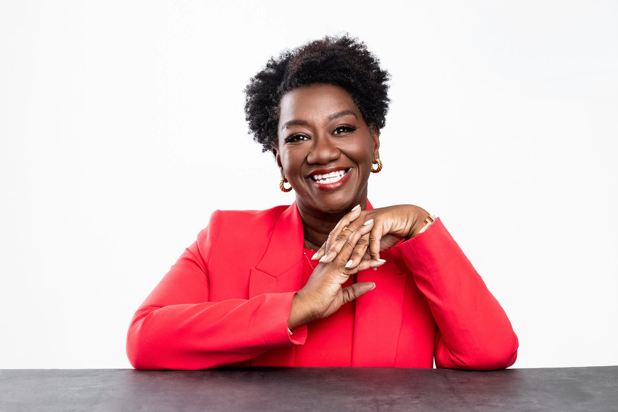 A vibrant and approachable headshot of Tressie McMillan Cottom, ideal for interviews or online profiles. This crisp studio image, captured by a Nashville Headshot Photographer, pairs modern energy with timeless professionalism.