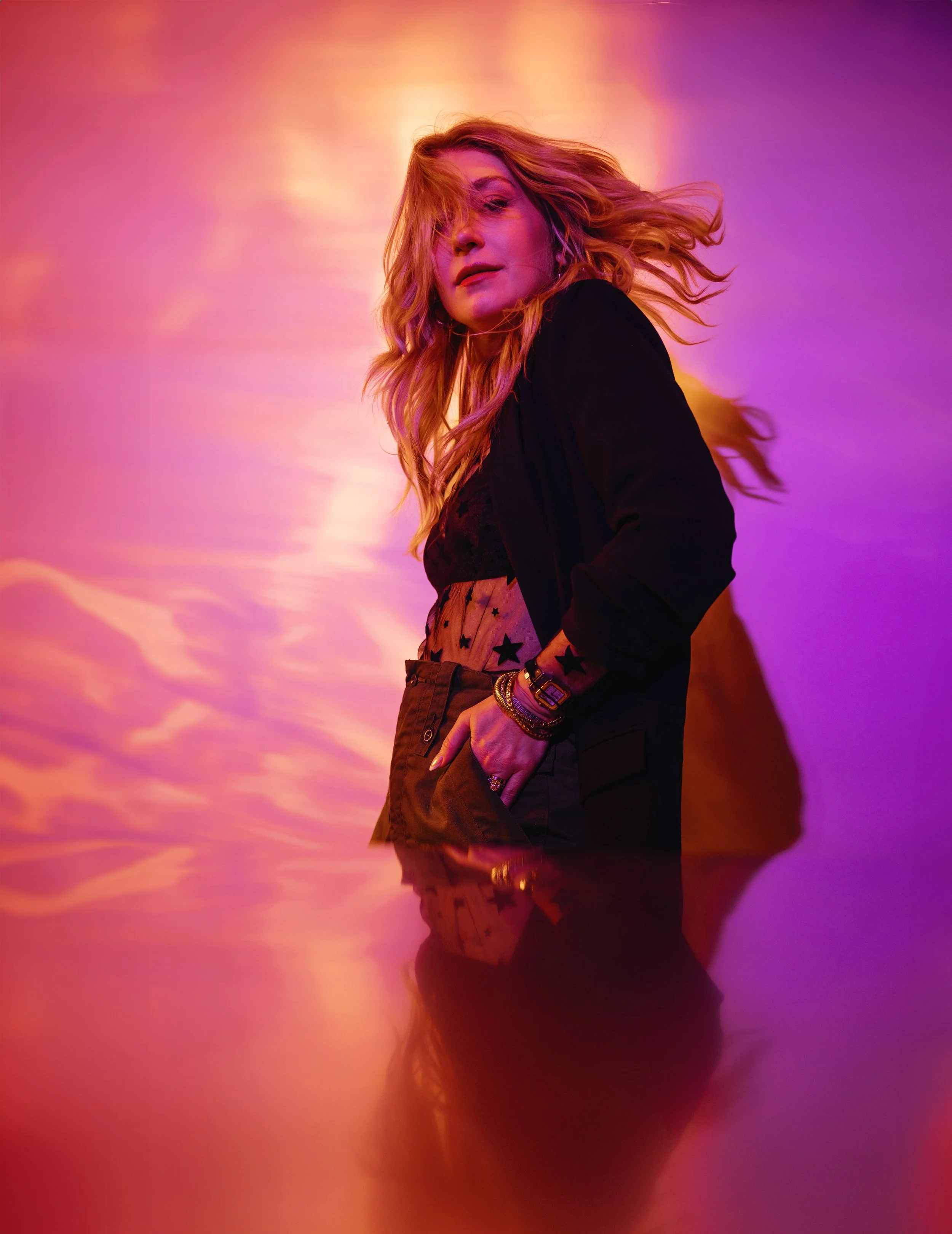 Creative portrait with bold pink and orange lighting from a photography workshop teaching studio lighting and artistic direction