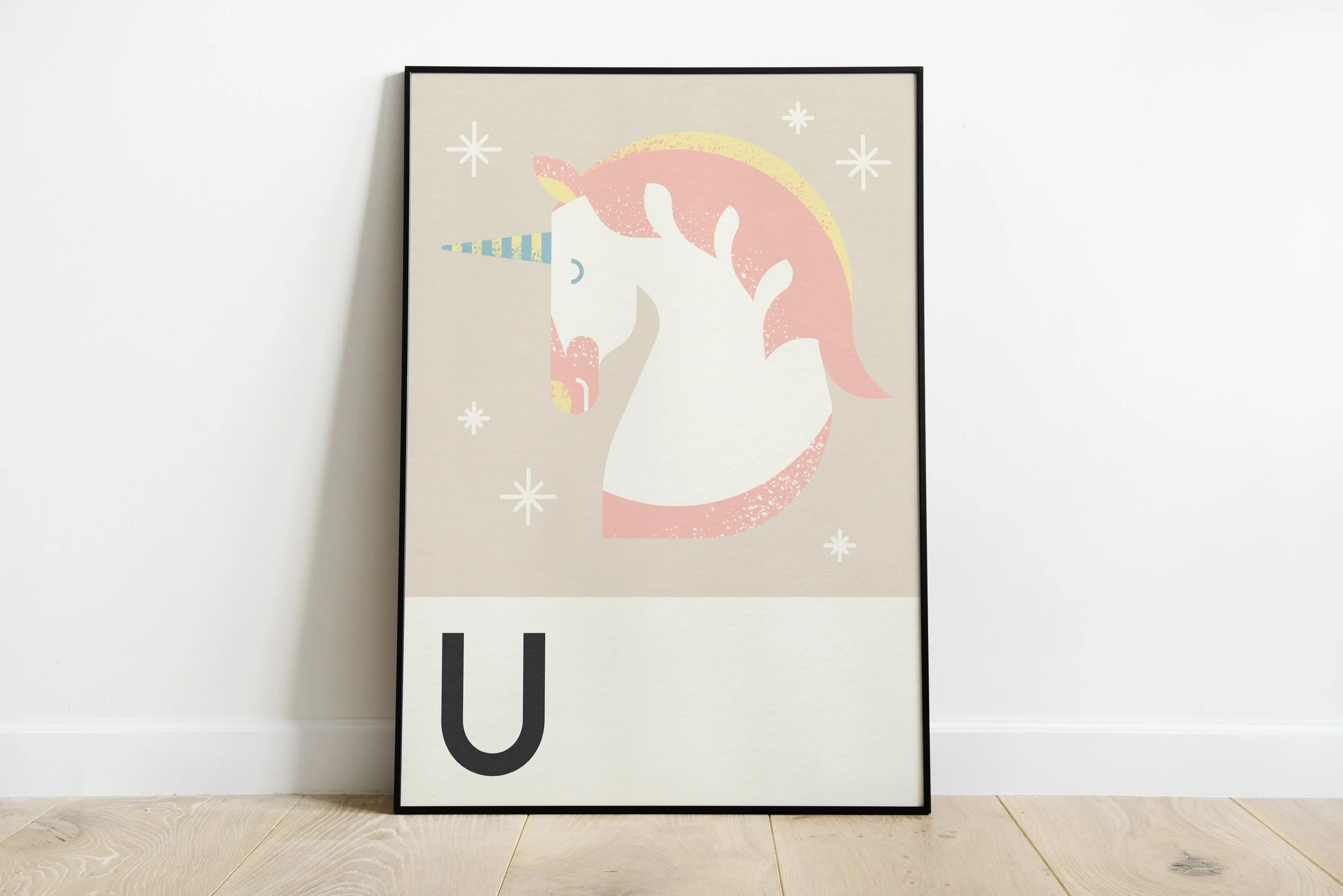 Framed unicorn illustration with pink hair and blue striped horn, decorated with stars, in minimalist style. The letter 'U' at the bottom.