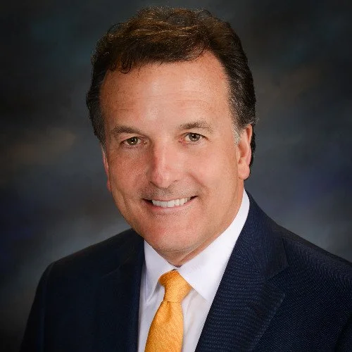 Headshot of Tim Dunham, MAI, SRA, showcasing over 38 years of excellence in real estate appraisal in Dayton, OH. Tim's extensive experience and prestigious Appraisal Institute credentials underscore his commitment to precision & insightful valuation.