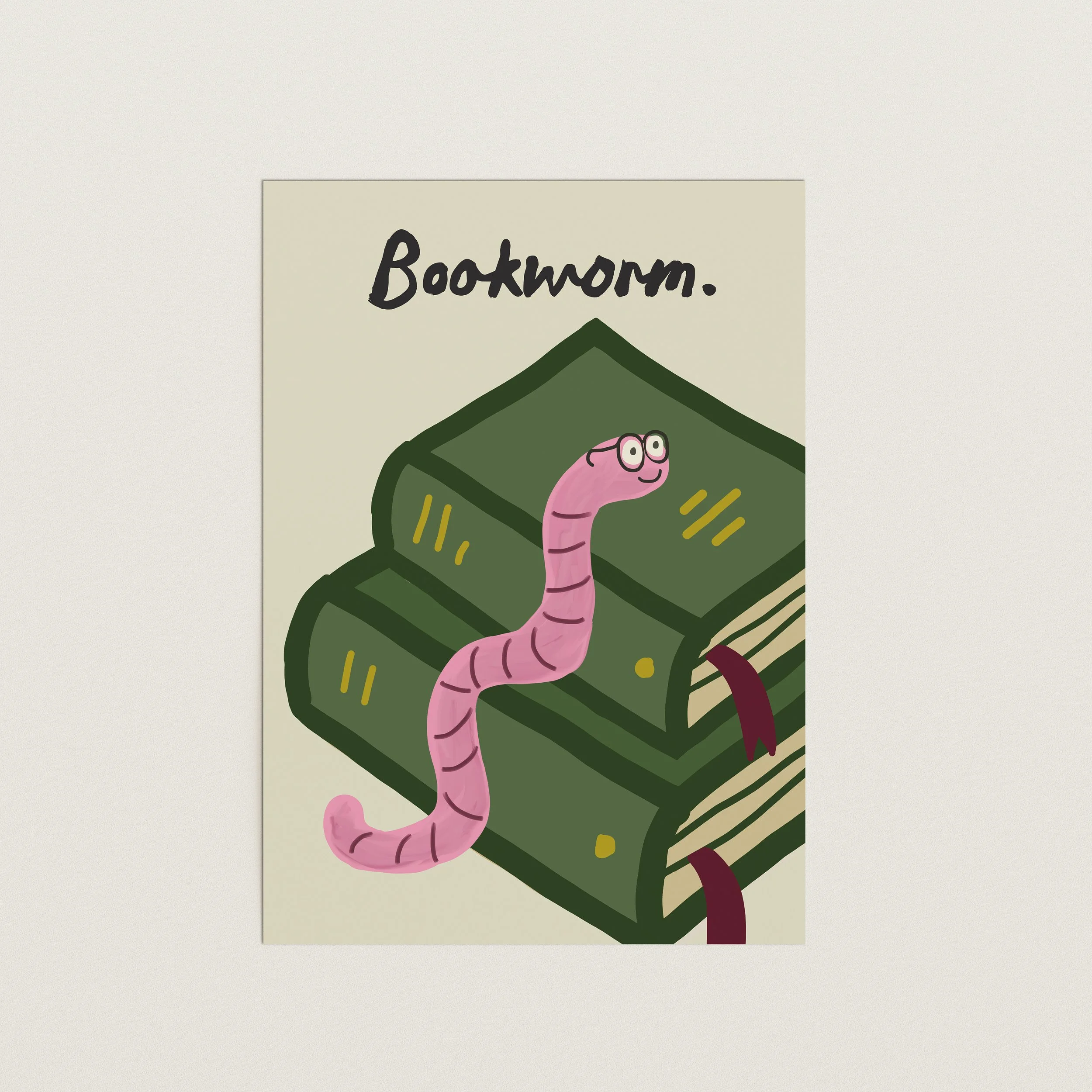 Bookworm art print featuring a pink illustrated worm on stacked green books with typography text