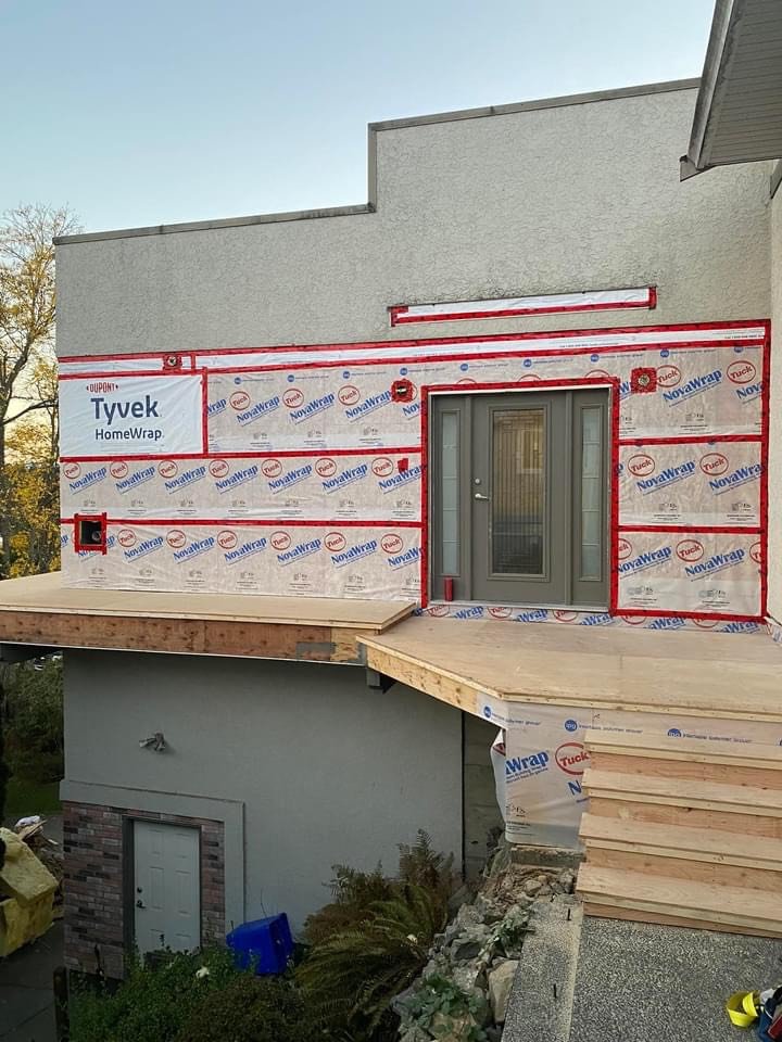 Corner reframed, sheathed and wrapped.