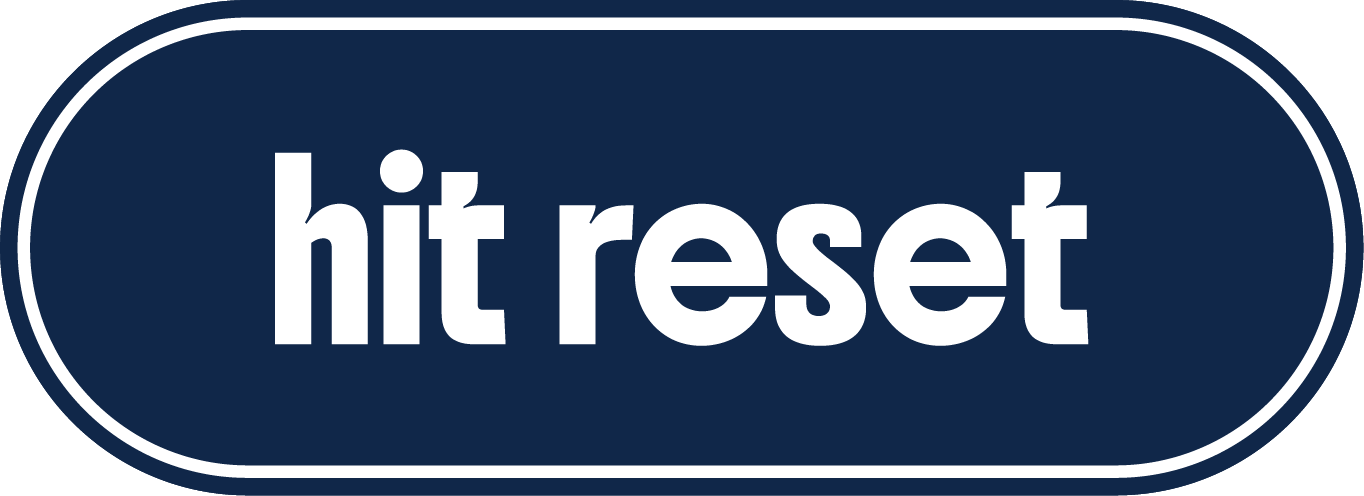 Blue oval button with white text that says "hit reset".
