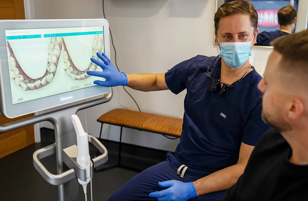 Invisalign dentist discussing 3D scan and Invisalign cost to patient