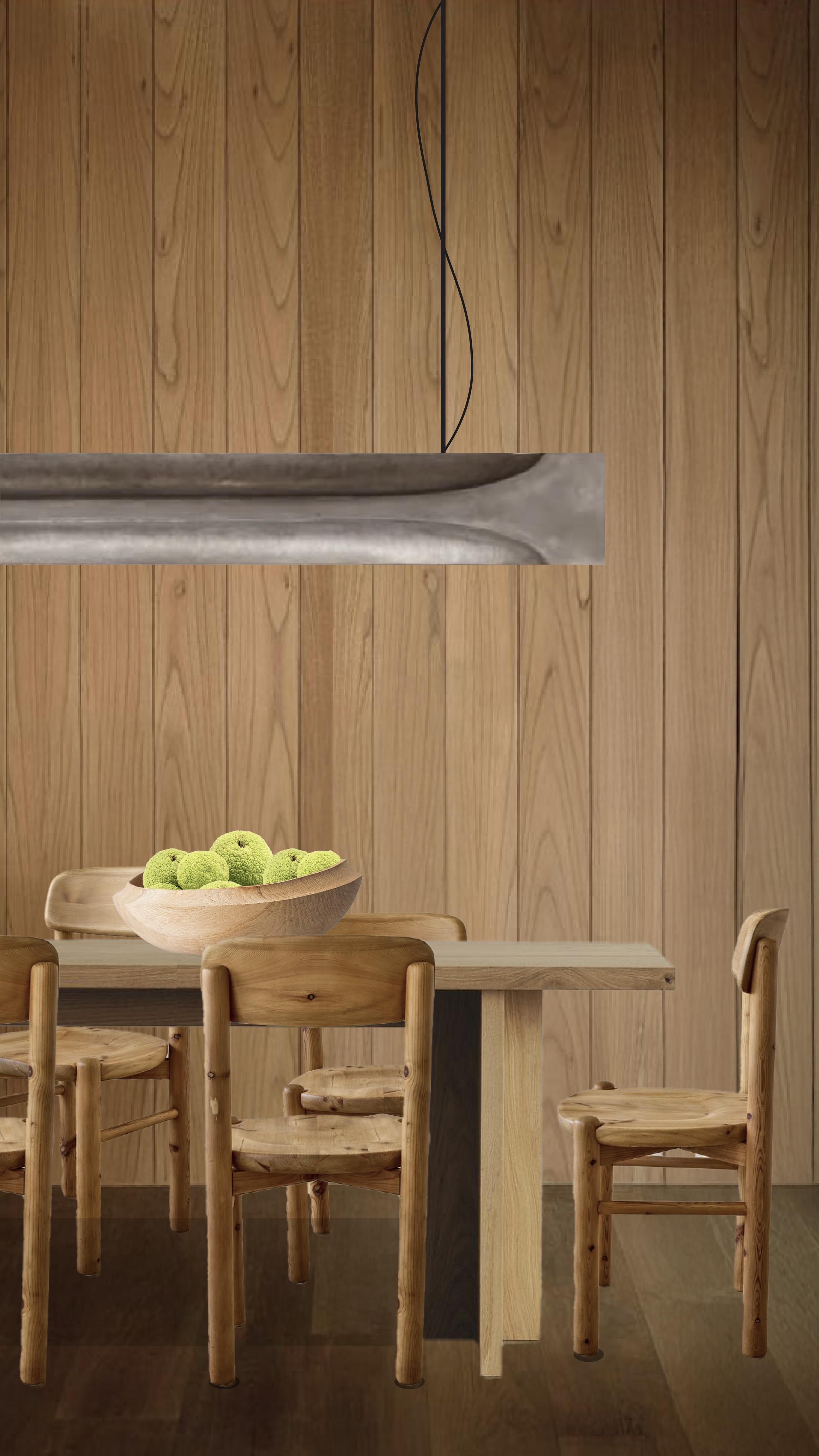 Wooden table with four chairs, a wooden bowl with green fluffy balls, and a wooden-paneled wall in the background.
