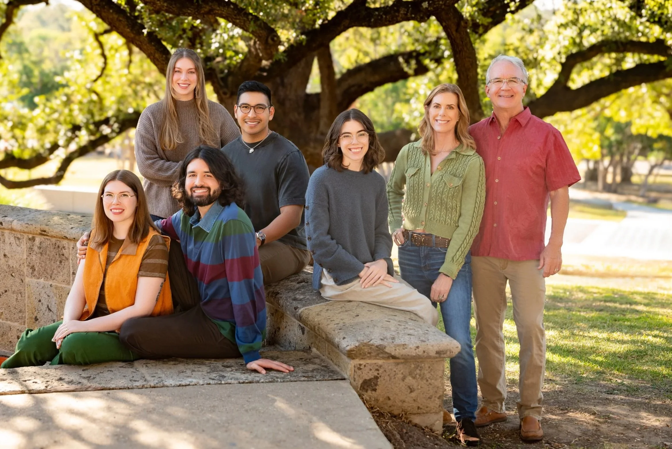 Family with adult children, in coordinated outfits posed at a San Antonio museum.