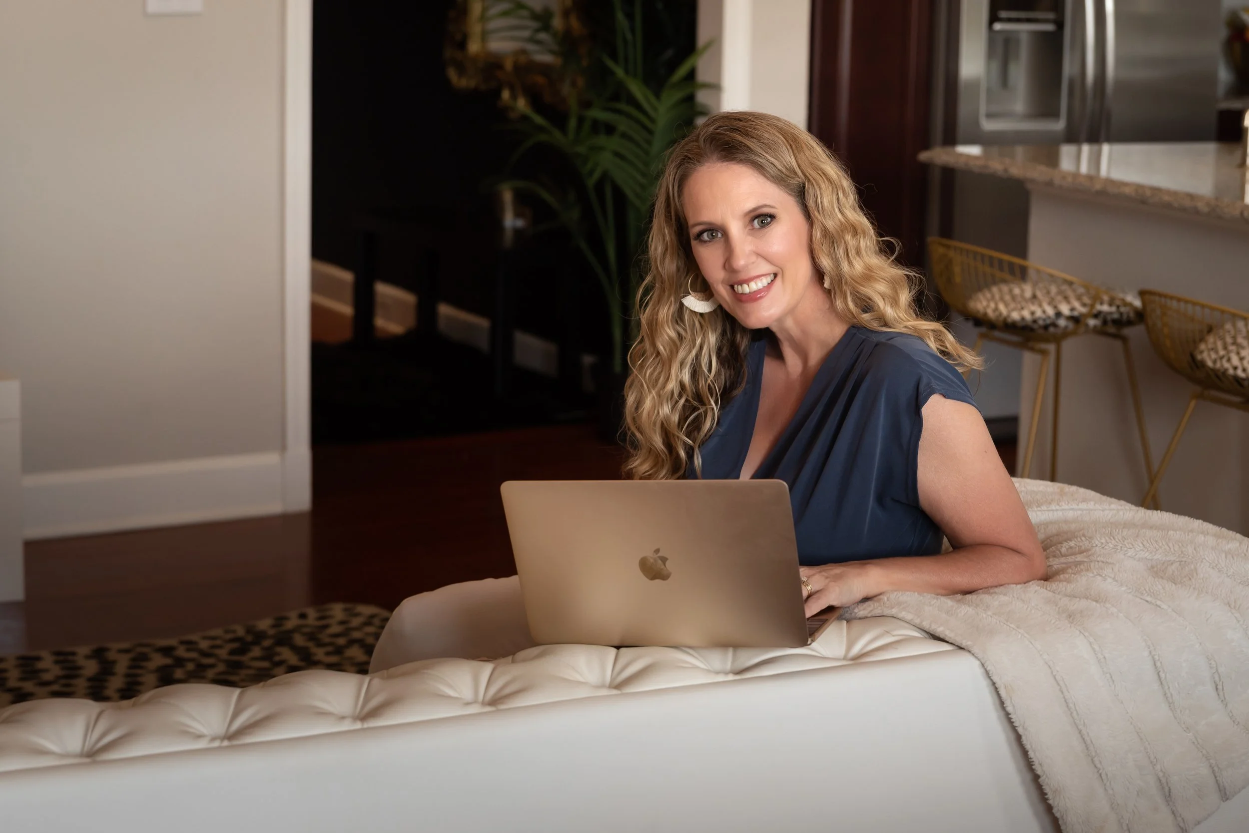 San Antonio branding photographer reviewing client website before portrait session.