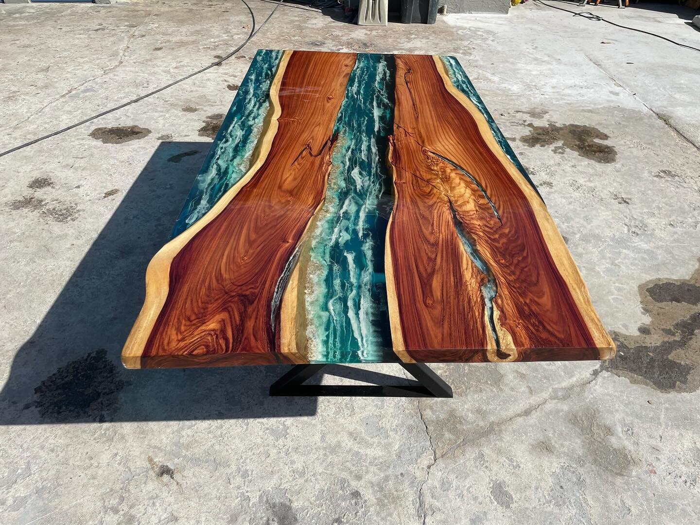 Finally completed! 10 weeks of perfecting this ocean themed table. 3 epoxy rivers added with crushed sea shells and multiple blue dyes. Waves were all done by hand on different levels. Top coat is a clear glossy polyurethane. It makes the clear and b