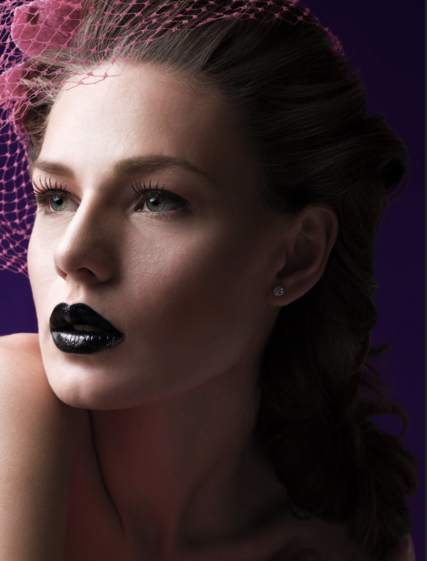 Up close portrait of woman with black lipstick