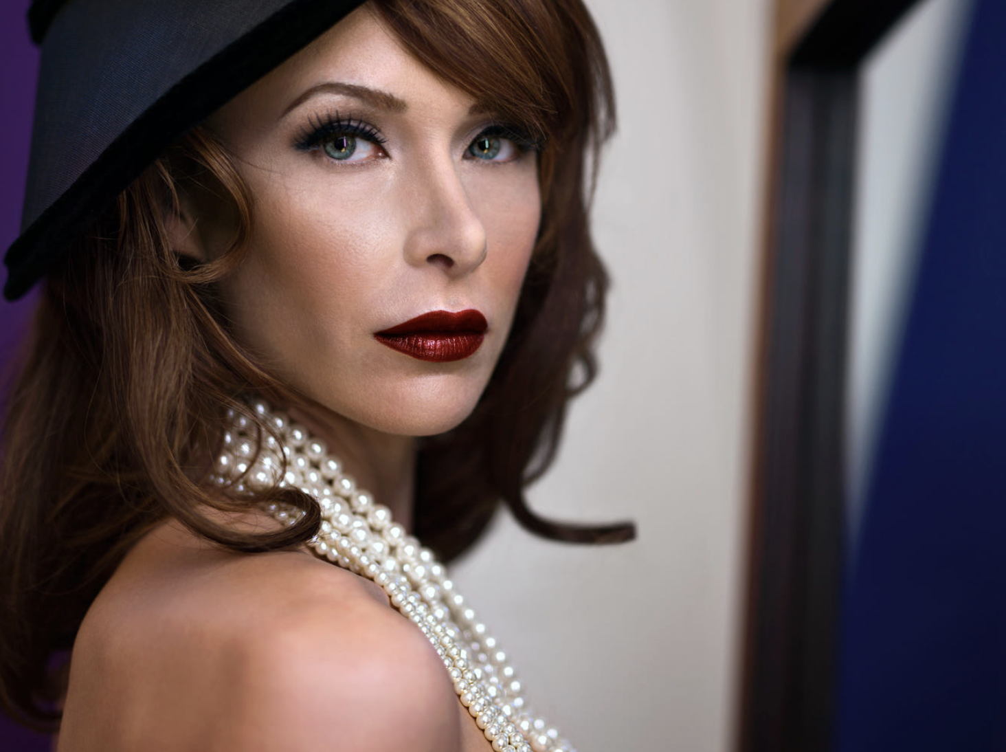 Sexy and sophisticated headshot of a middle aged woman by Oliver Solomon 