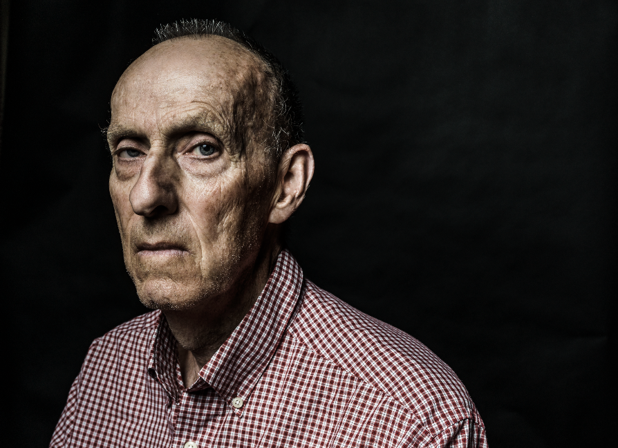 Dark and Edgy portrait of older man showing life experience