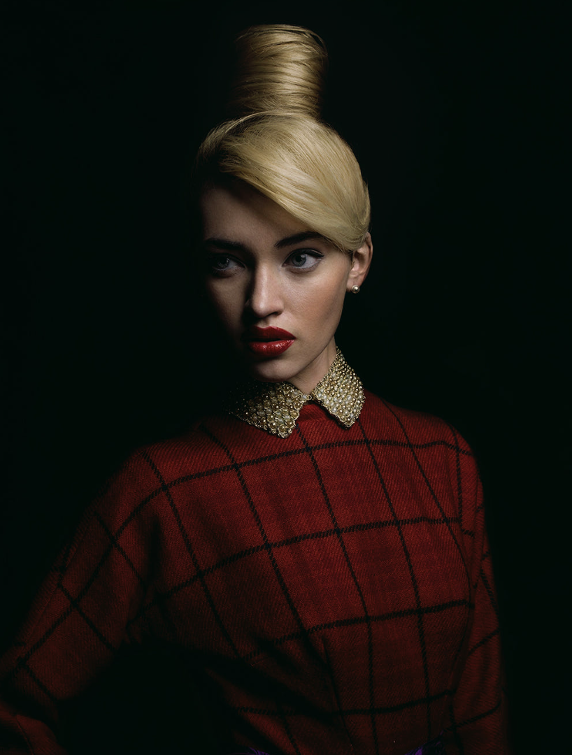 Dramatic portrait photograph of a woman with unique style