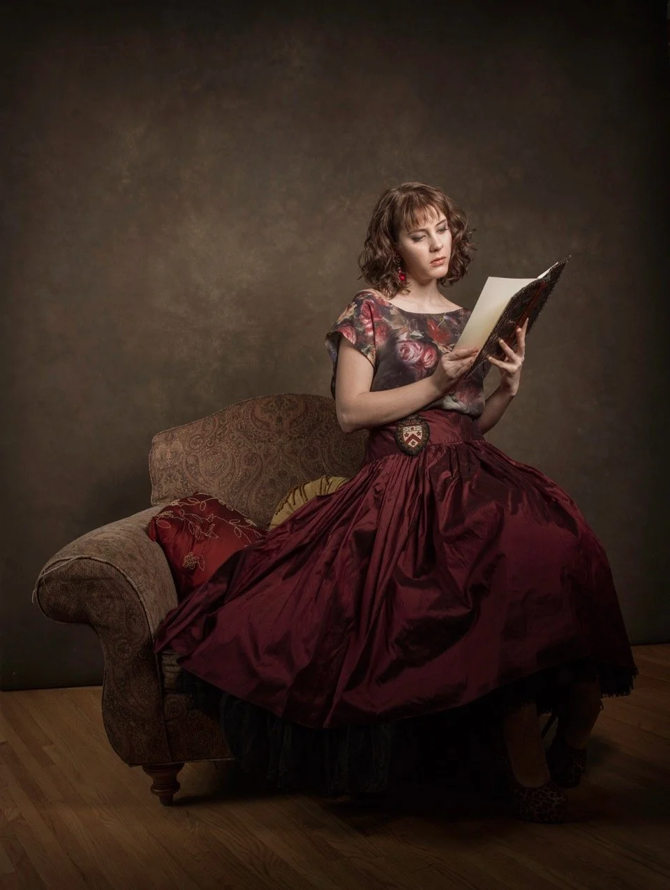 Period portrait of a woman reading a book by Oliver Solomon