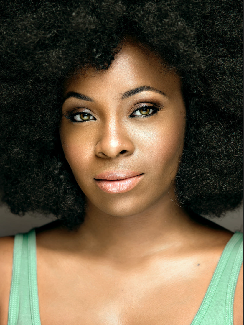Beautiful headshot of a black woman by Oliver Solomon