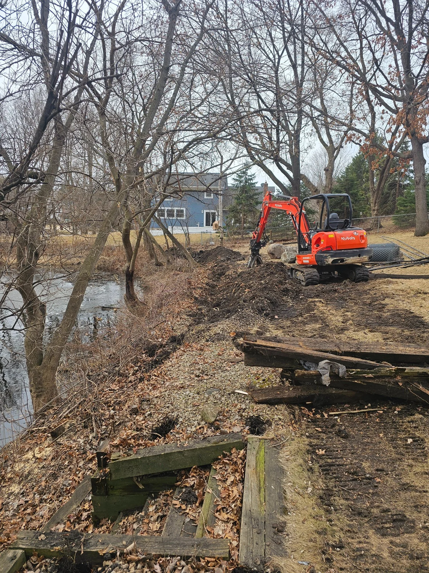 Rotting timber pond wall before demolition — Woodbury MN — Heritage Outdoors 2025