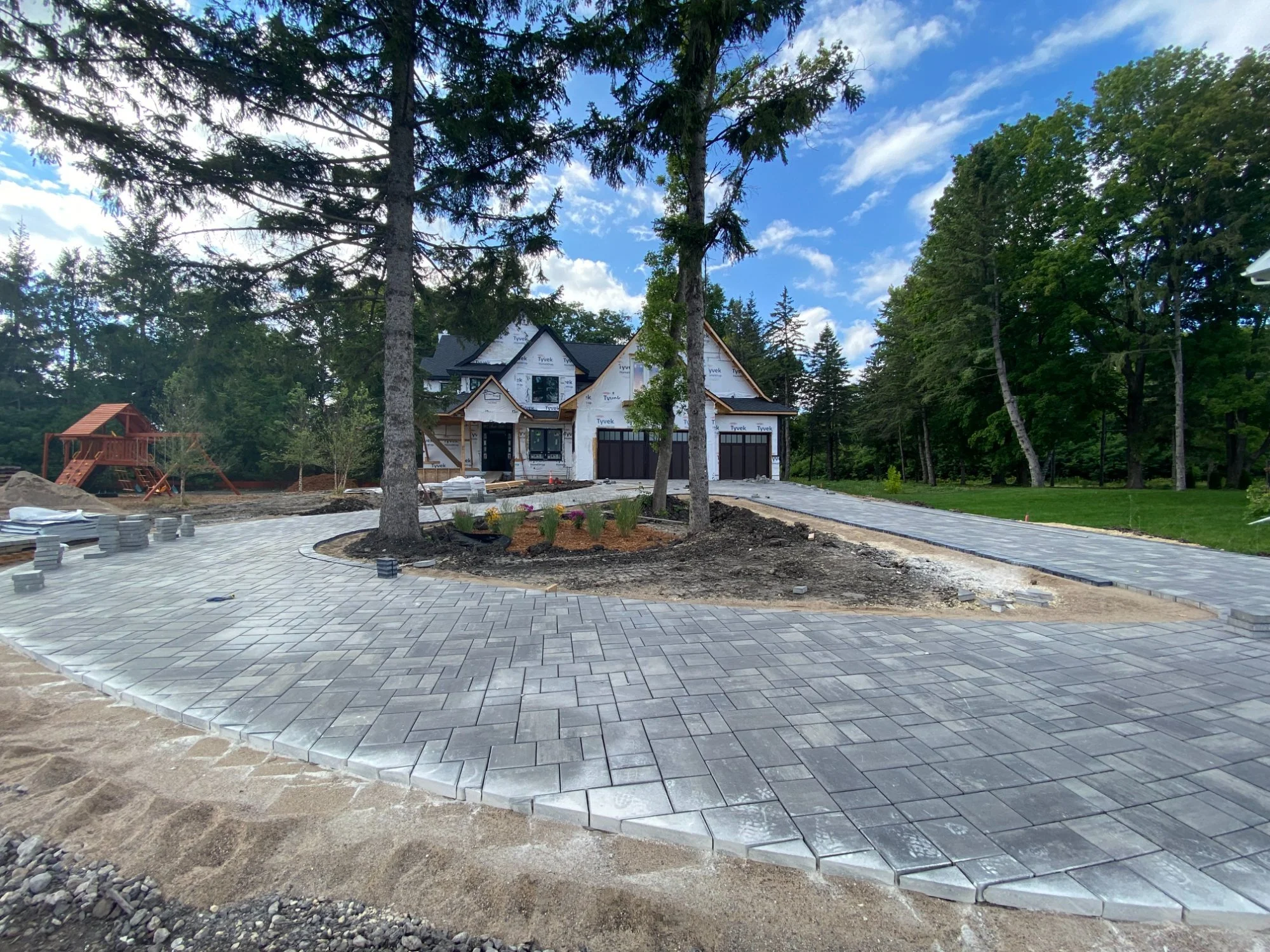 Unilock paver driveway nearly complete front view — Plymouth MN — Heritage Outdoors