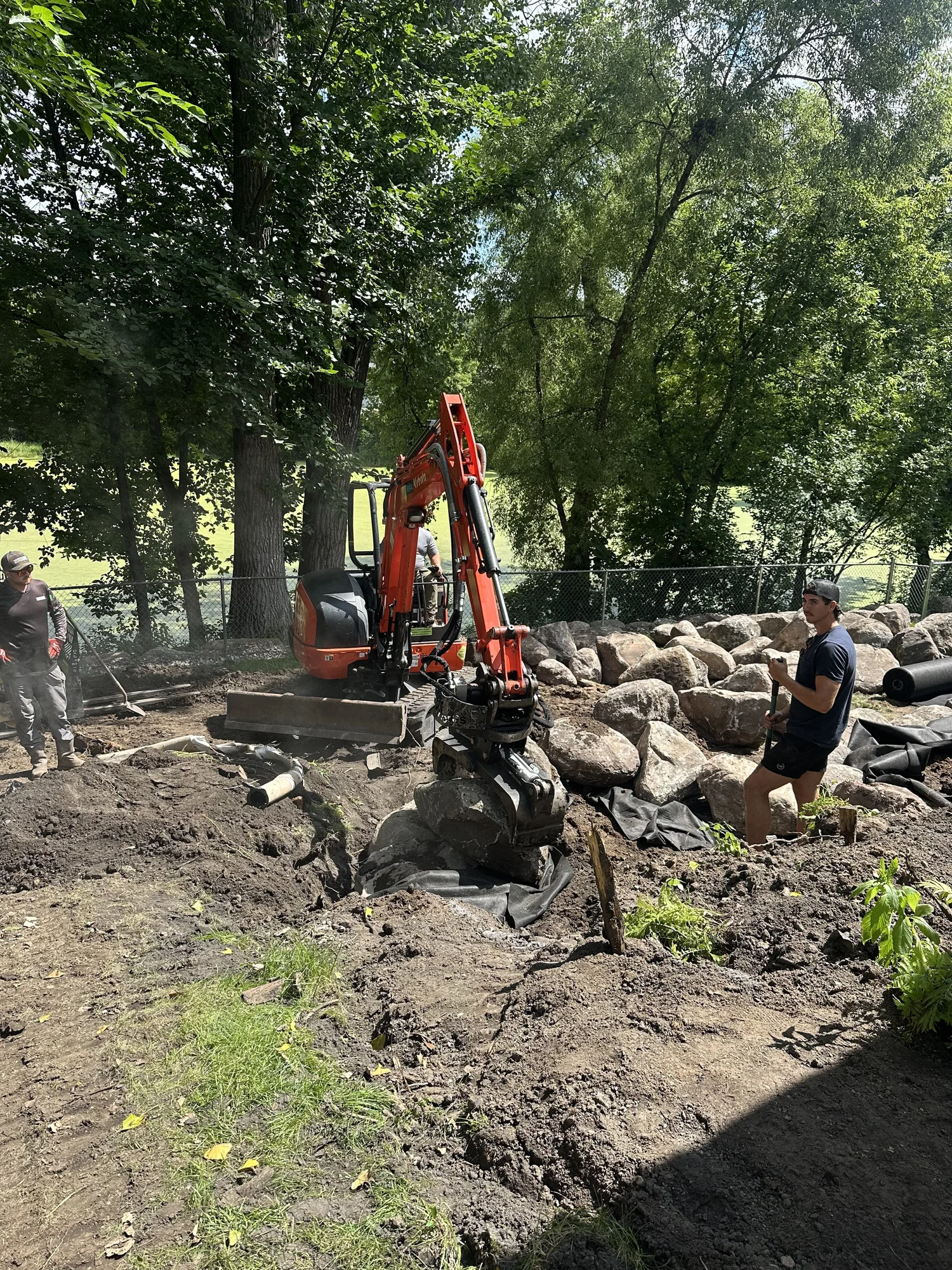 Boulder wall and cut steps planting bed detail — Woodbury MN — Heritage Outdoors 2025