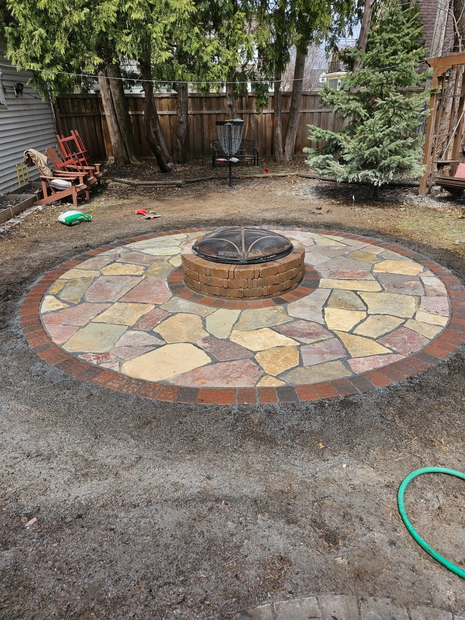Natural flagstone firepit circle — the stone does the talking — Heritage Outdoors