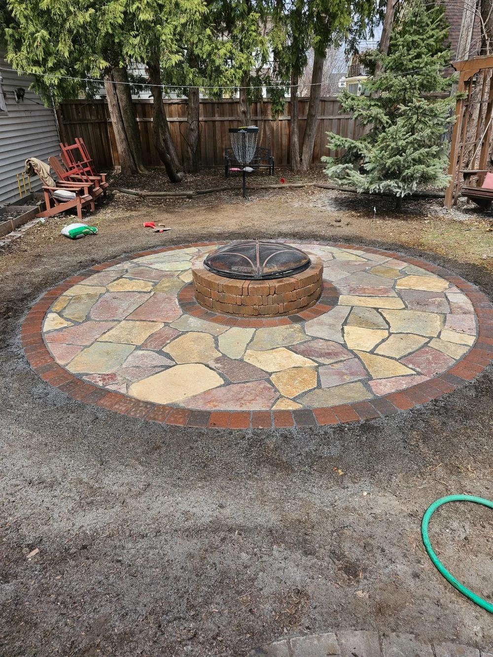 Completed flagstone firepit circle patio — Highland Park Saint Paul MN — Heritage Outdoors 2025