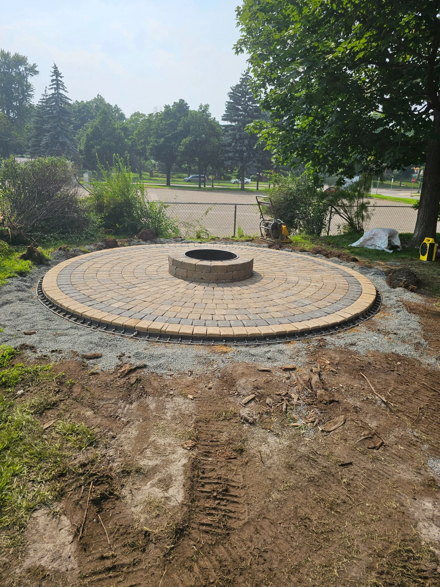 Willow Creek circle kit firepit patio during installation — Summit Hill Saint Paul MN — Heritage Outdoors 2025