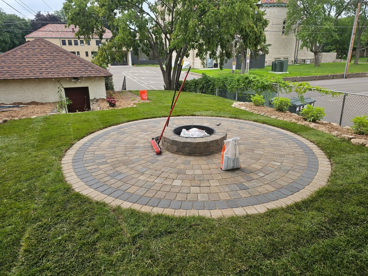 Completed Willow Creek firepit patio with sod wide view — Summit Hill Saint Paul MN — Heritage Outdoors 2025