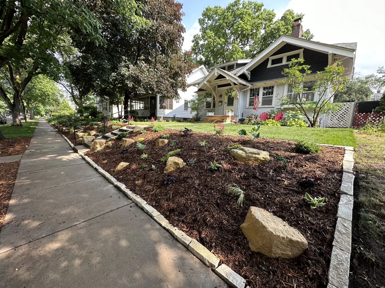 Completed limestone outcropping front yard — Macalester-Groveland Saint Paul MN — Heritage Outdoors 2023