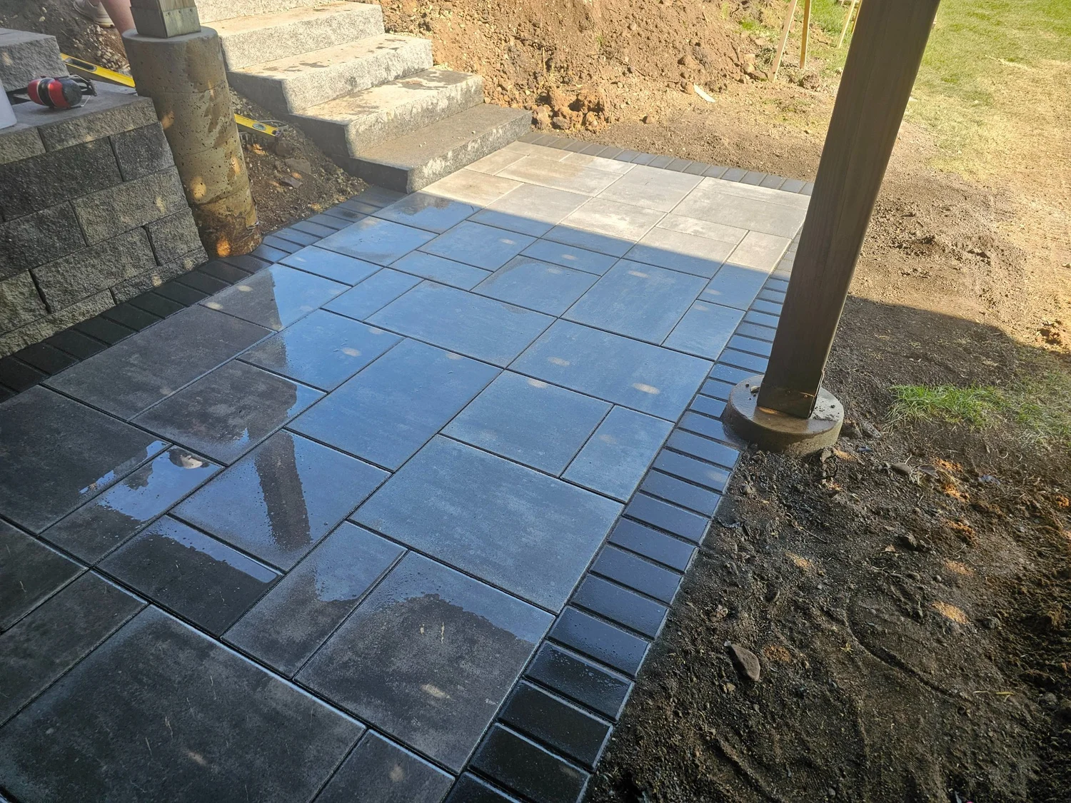 Natural granite steps leading up to paver pool deck — Lake Elmo MN — Heritage Outdoors