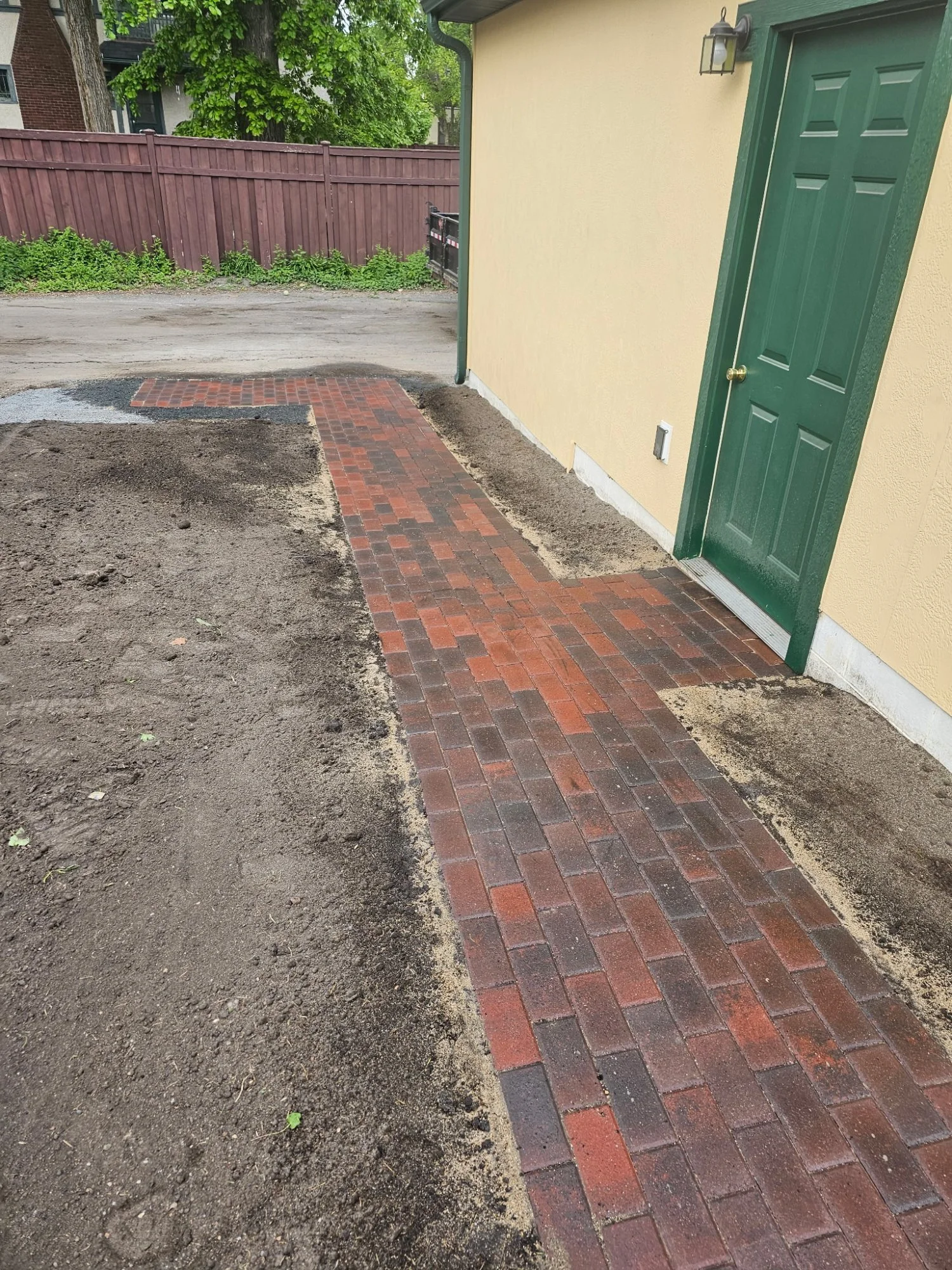 Completed Willow Creek Brickstone RoseCreek walkway at garage door — Mac-Groveland Saint Paul MN — Heritage Outdoors 2025
