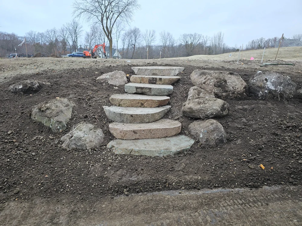 Cut boulder steps and fieldstone wall — Wayzata Country Club golf course renovation — Heritage Outdoors 2024