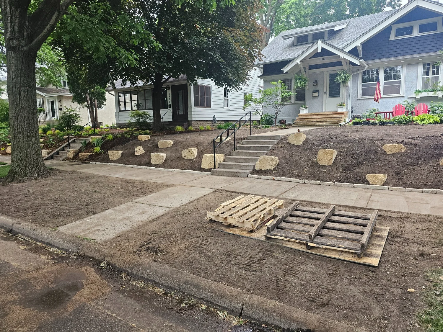 During — limestone outcroppings placed across front yard — Saint Paul MN — Heritage Outdoors 2023