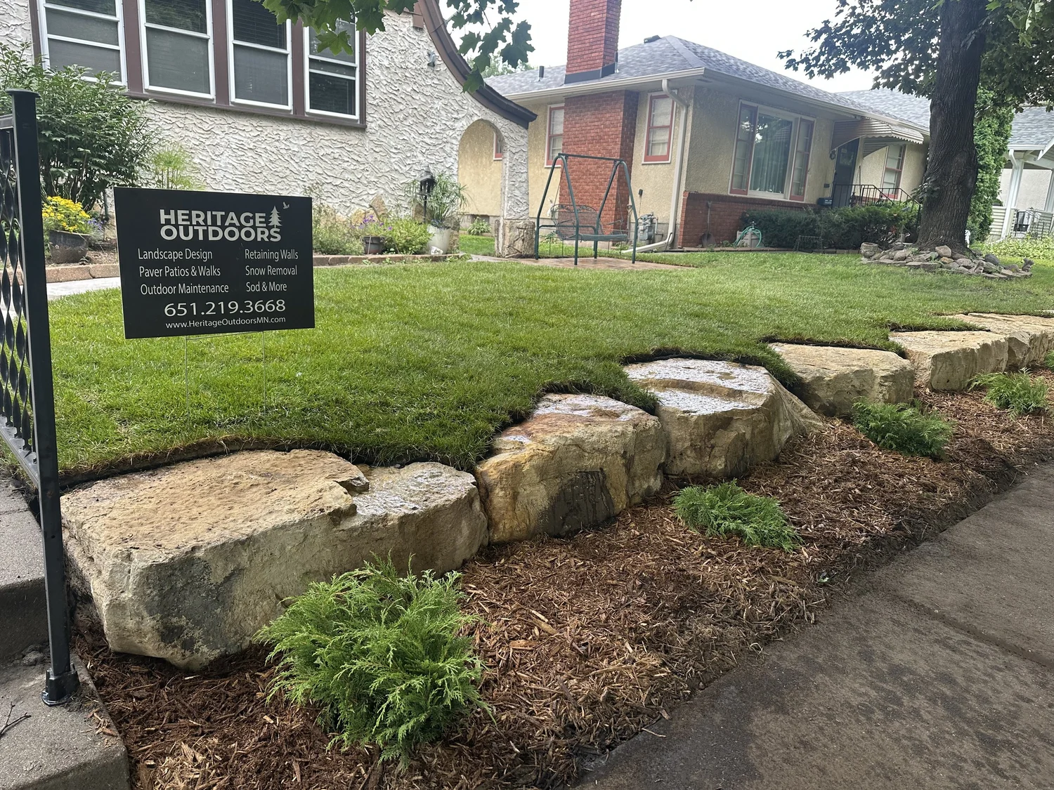Completed limestone cube wall with Russian cypress — Saint Paul MN — Heritage Outdoors 2025