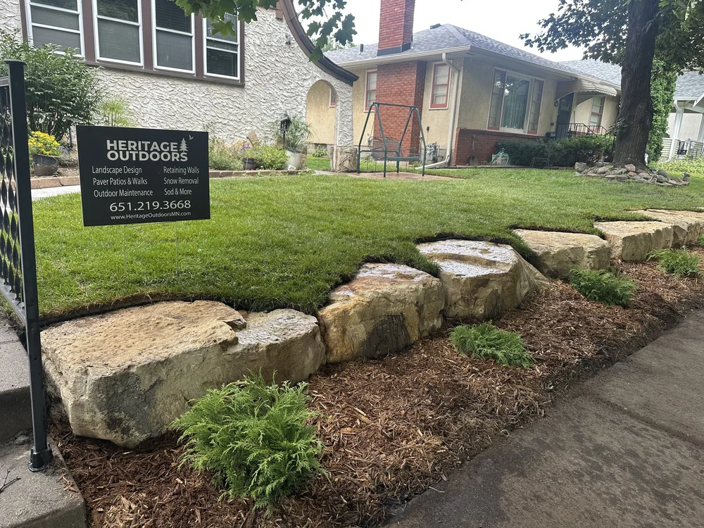 Completed limestone cube wall with Russian cypress — Randolph Ave Saint Paul MN — Heritage Outdoors 2025