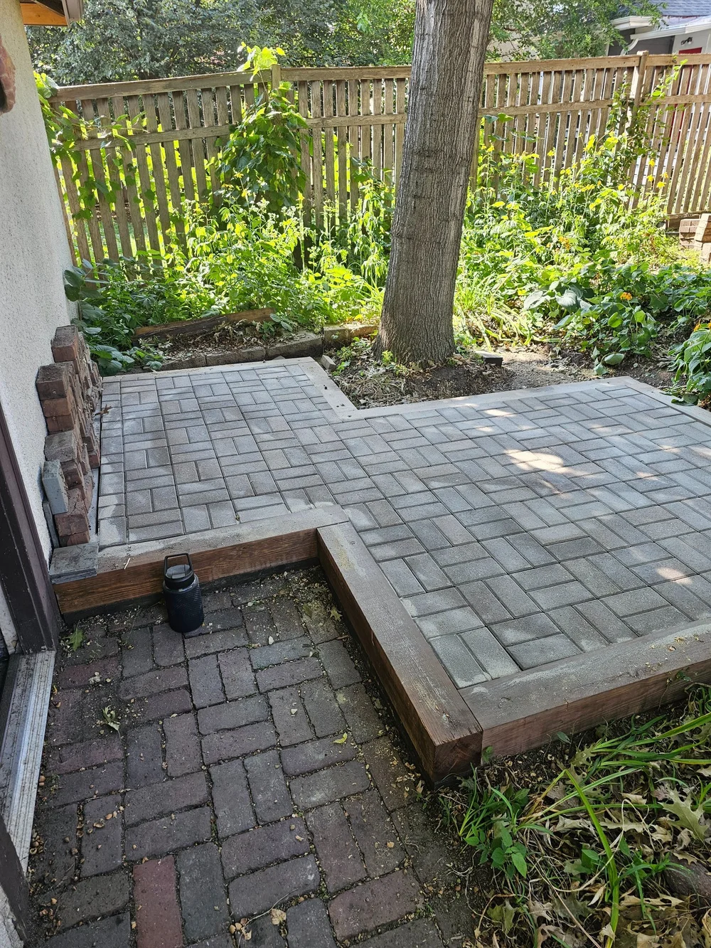Patio relevel and relay next to tree — Saint Paul MN — Heritage Outdoors