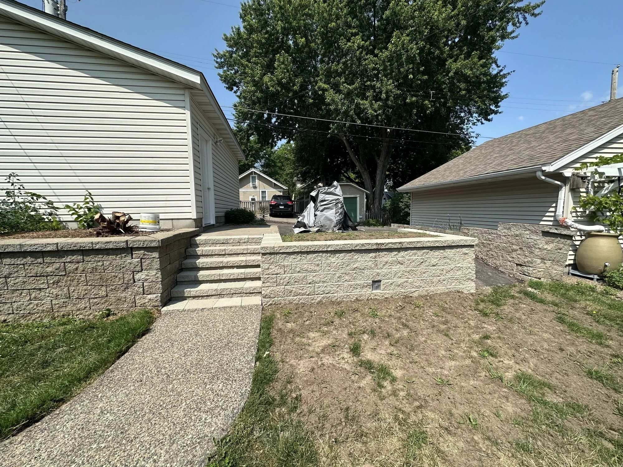 Versa-Lok block retaining wall and steps rebuild complete — Saint Paul MN — Heritage Outdoors 2023