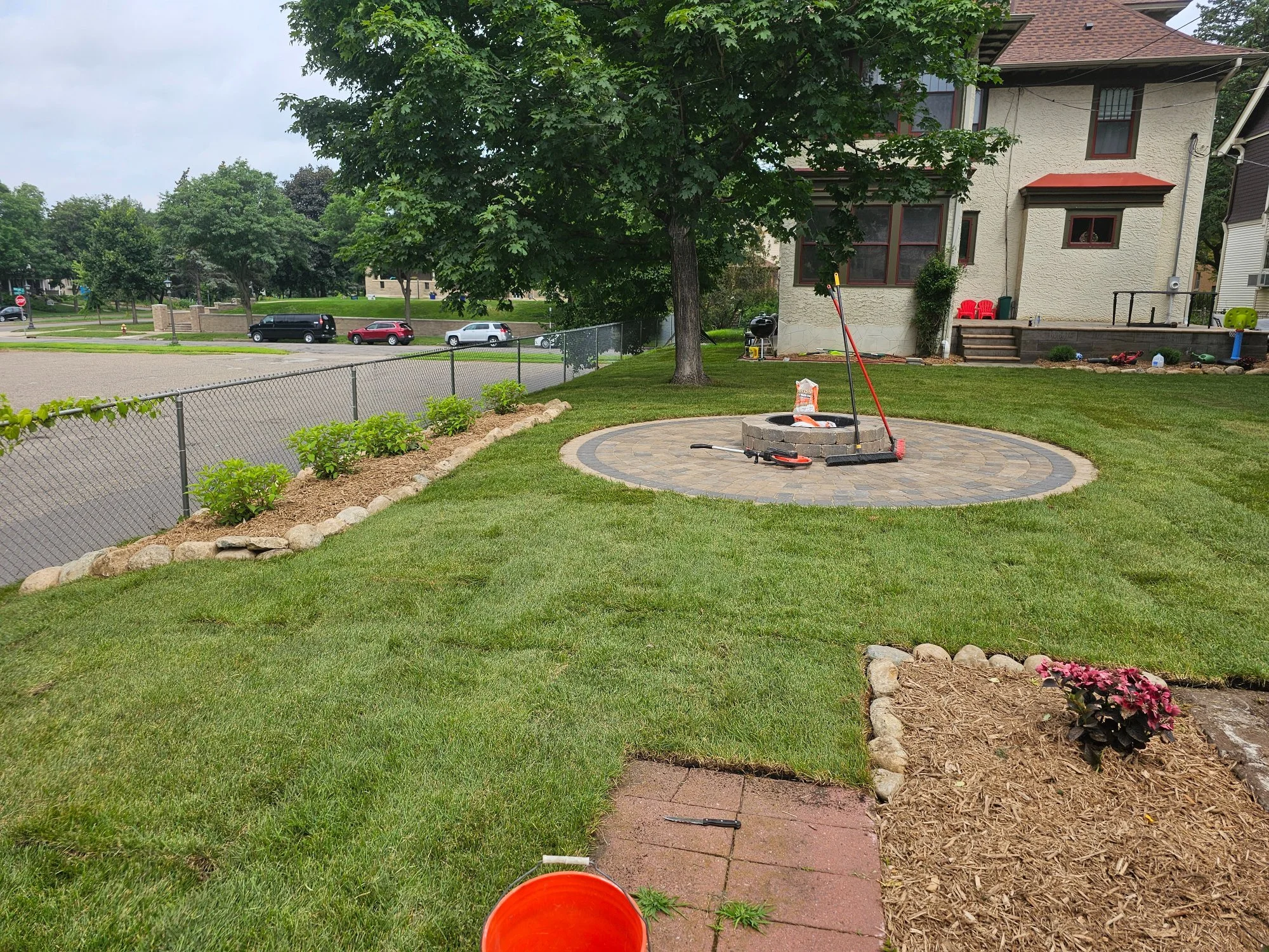 Completed firepit patio sod and garden beds full backyard view — Summit Hill Saint Paul MN — Heritage Outdoors 2025