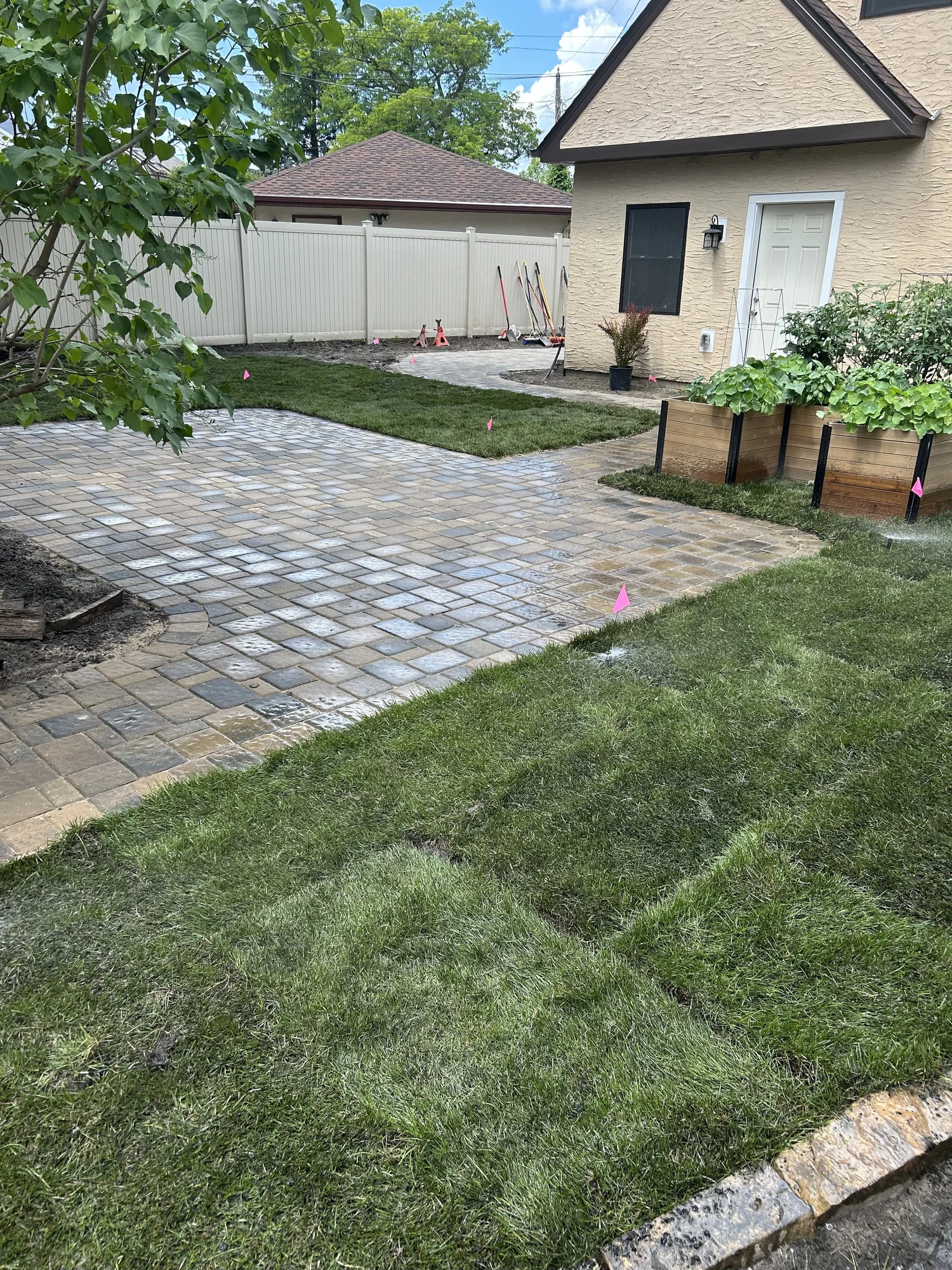 Willow Creek Cobblestone patio parking pad with fresh sod — Como Park Saint Paul MN — Heritage Outdoors 2025