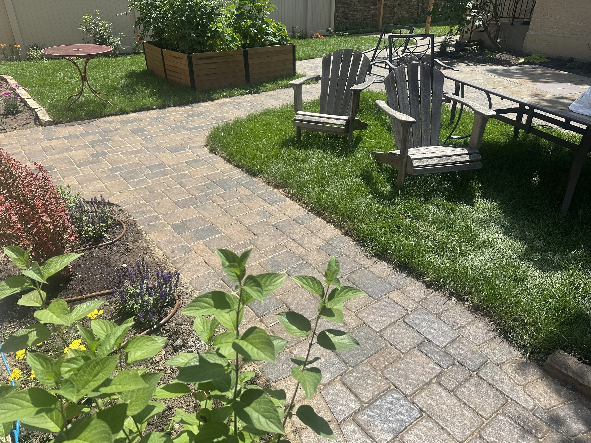 Completed Willow Creek Cobblestone patio, walkway and parking pad — Como Park Saint Paul MN — Heritage Outdoors 2025