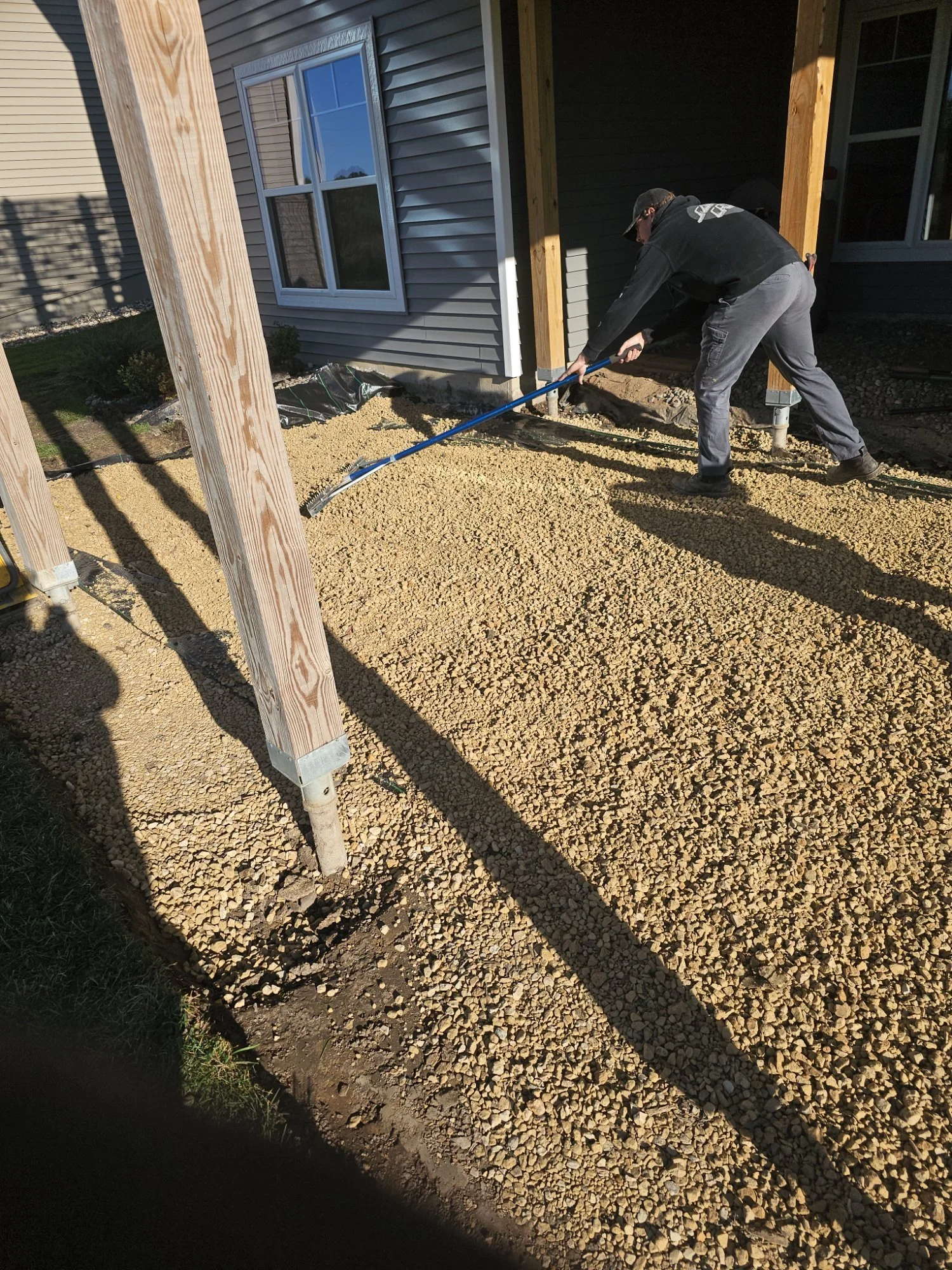 Gravel base prep under deck during patio installation — Hugo MN — Heritage Outdoors 2025