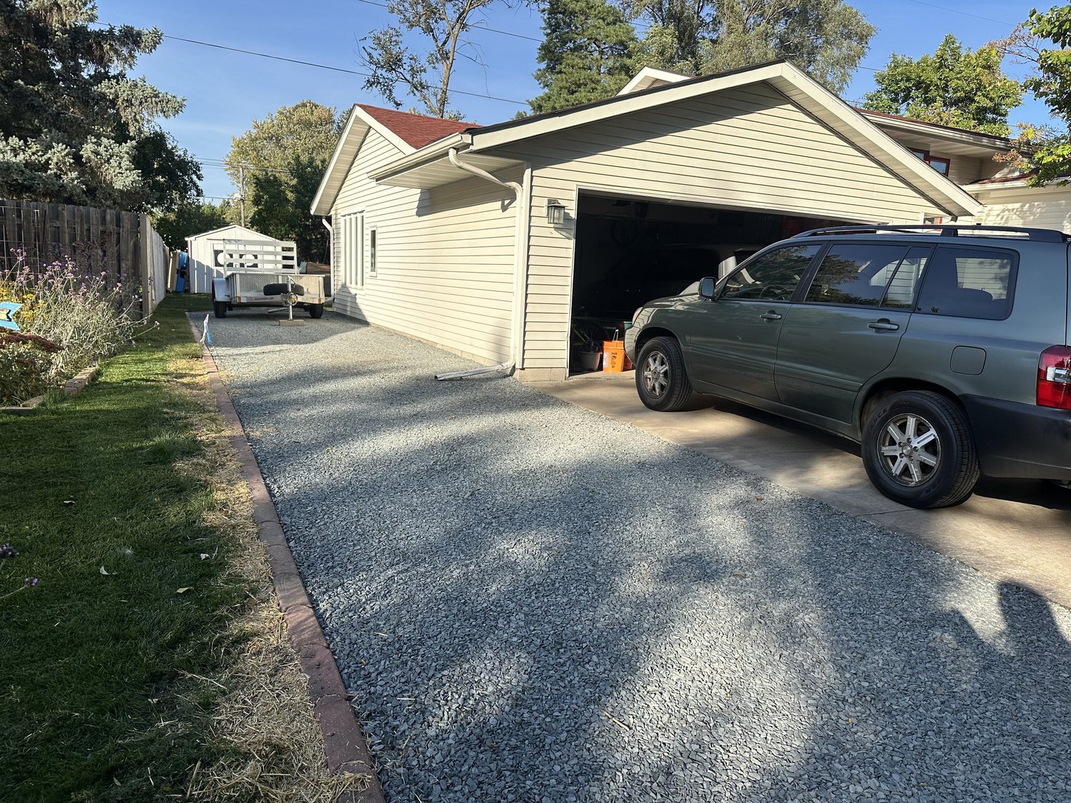 Trap rock parking pad extension with room for vehicles and trailer — Roseville, MN — Heritage Outdoors 2025