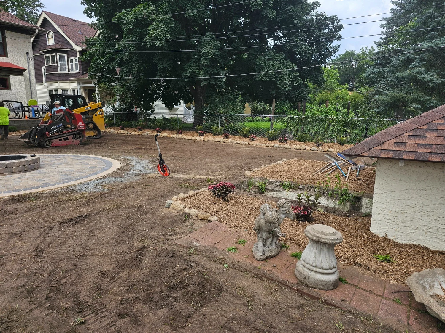 Backyard grading with firepit patio and garden beds taking shape — Summit Hill Saint Paul MN — Heritage Outdoors 2025