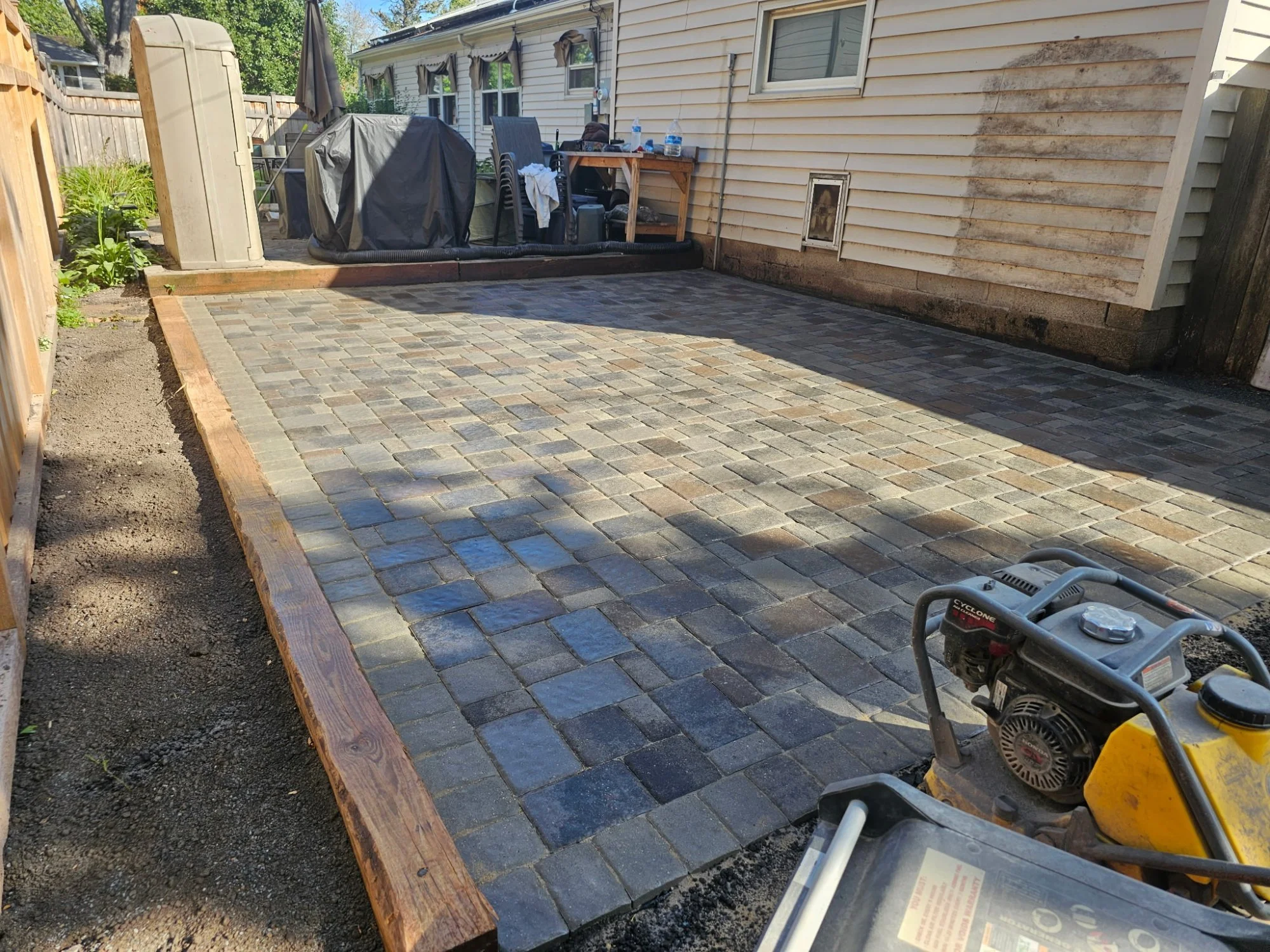 Completed Willow Creek Bronze Blend paver patio — Highland Park, Saint Paul MN — Heritage Outdoors 2025
