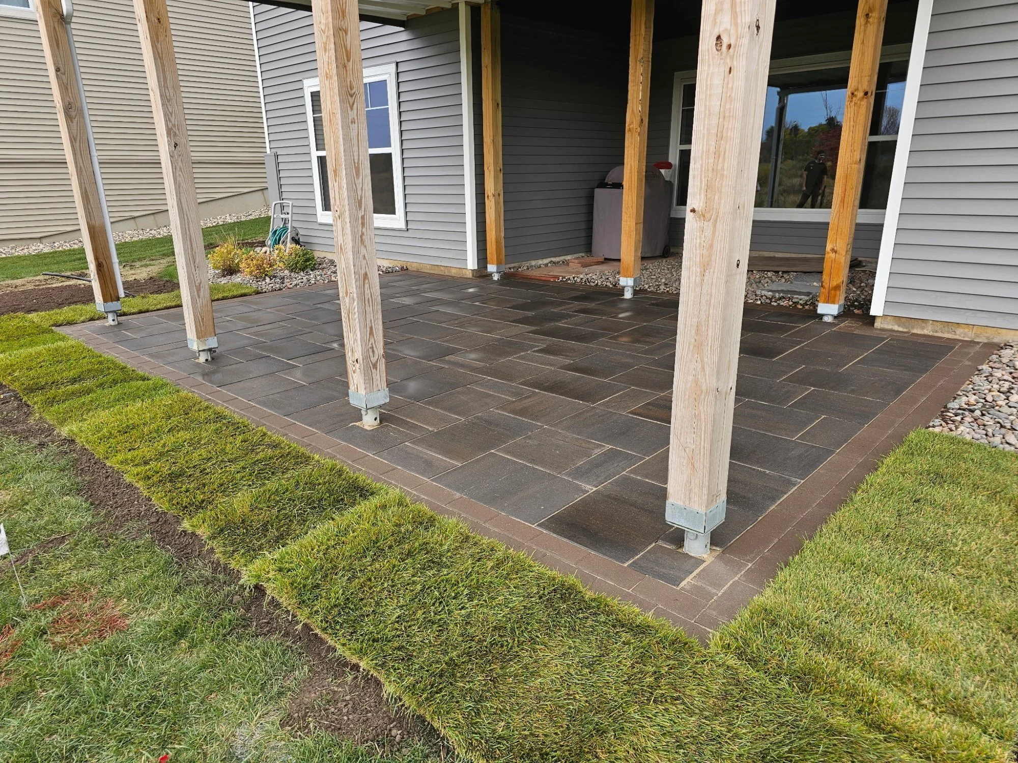 Completed RCP Windom paver patio under deck — Rice Lake Reserve, Hugo MN — Heritage Outdoors 2025