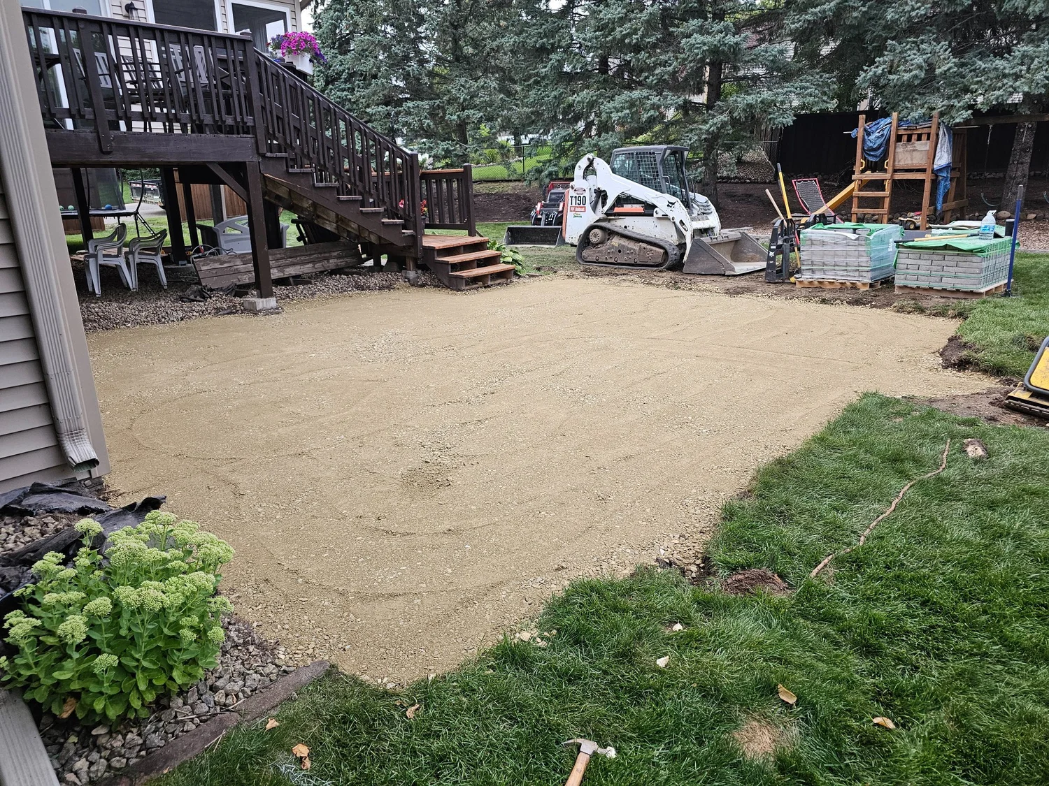 Paver patio base prep and excavation with Bobcat T190 — Woodbury MN — Heritage Outdoors 2024