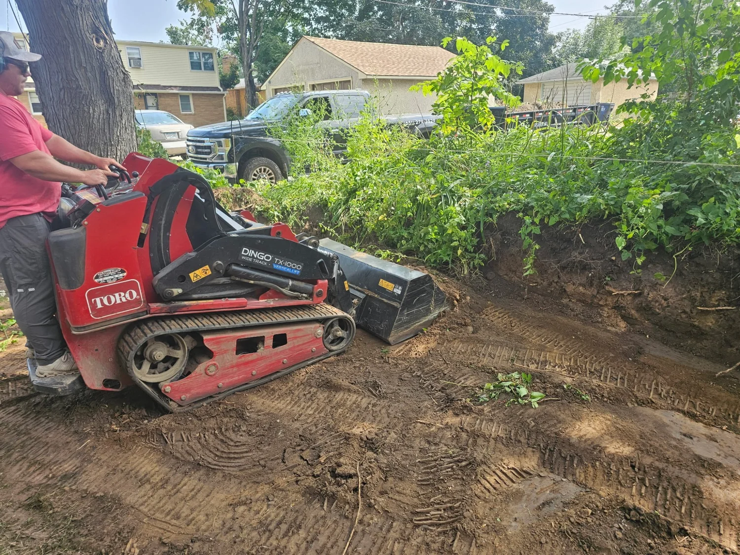 Toro Dingo TX-1000 excavating hillside for Versa-Lok retaining wall — Como Park Saint Paul — Heritage Outdoors 2025
