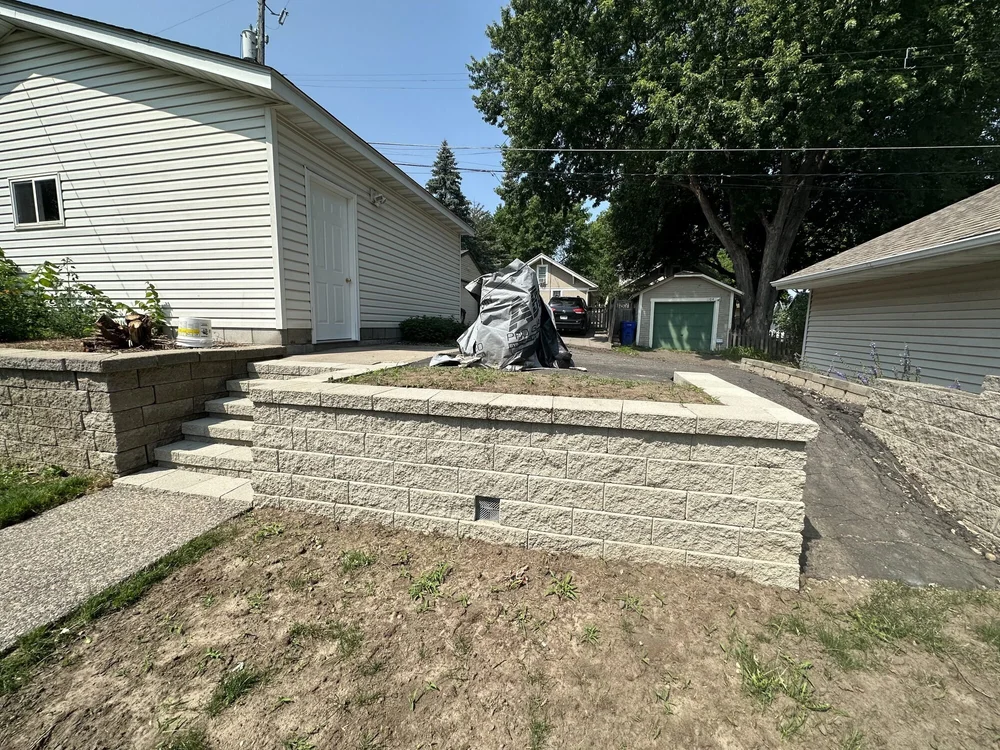 Completed Versa-Lok retaining wall rebuild with drain tile and new steps — Como Park Saint Paul MN — Heritage Outdoors