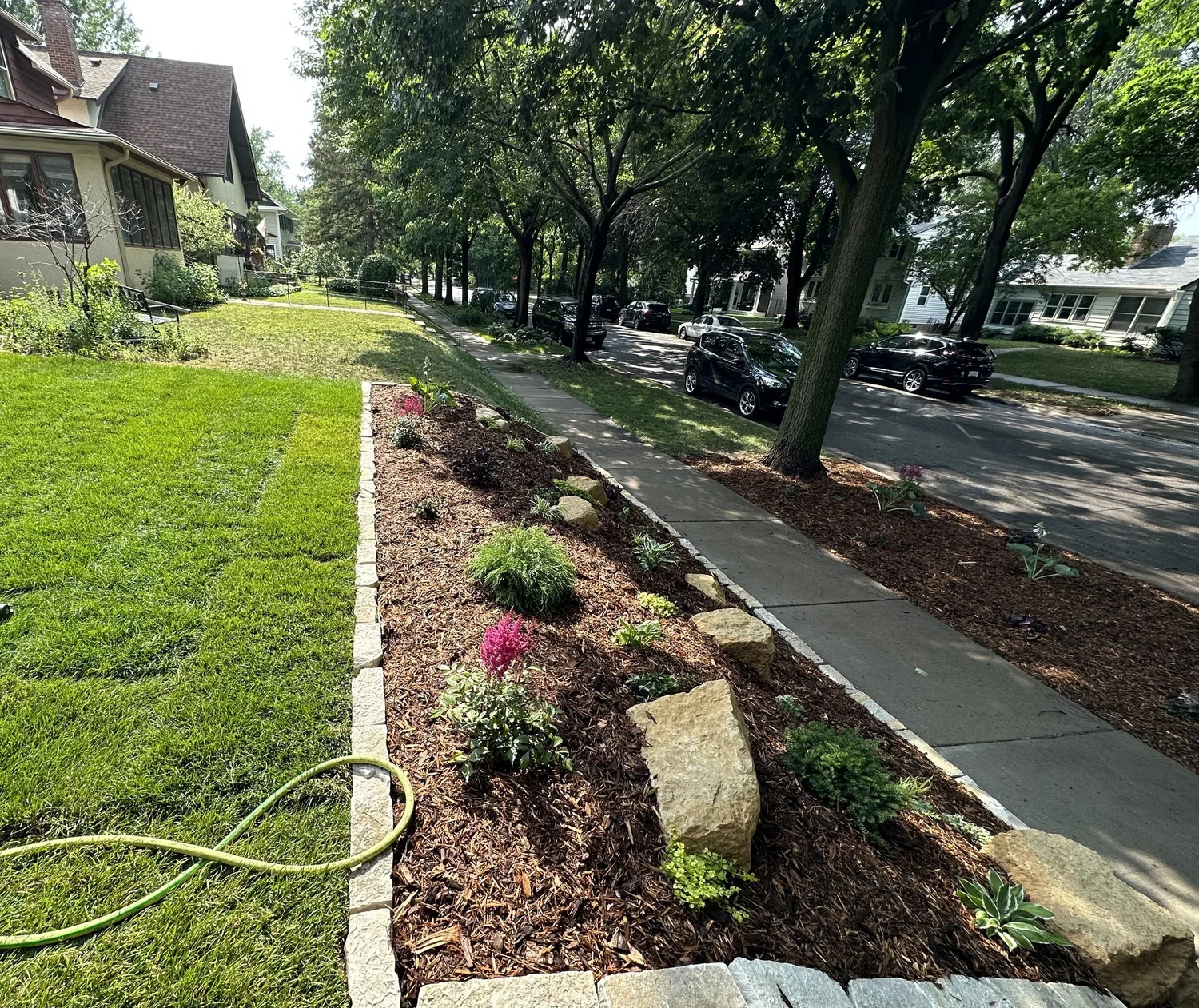 Completed mixed perennials and limestone outcroppings — Saint Paul MN — Heritage Outdoors 2023